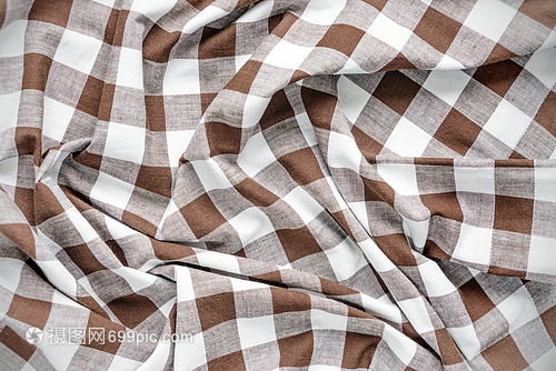 油白色和棕经检查的棉布缝合